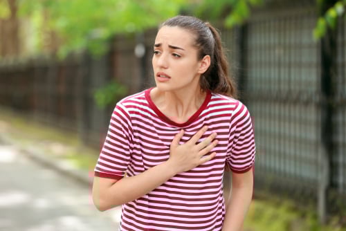 Young,Woman,Suffering,From,Heart,Attack,Outdoors MORE YOUNG PEOPLE ARE DYING FROM HEART ATTACKS, NEW STUDY SAYS