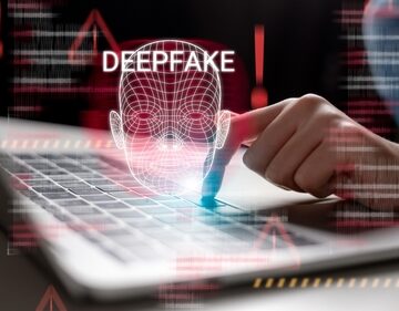 Concept image of deepfake technology and cybersecurity with a 3-d facial recognition display.