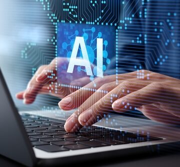 Conceptual image of artificial intelligence technology being utilized on a laptop computer.