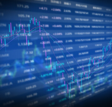 Image displays a digital financial data screen showing stock market analytics, trends, and volume data.