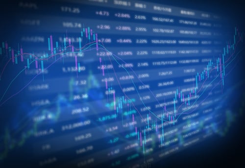 Image displays a digital financial data screen showing stock market analytics, trends, and volume data.