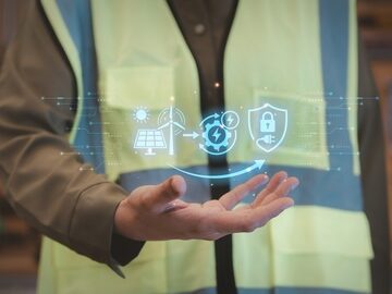 Conceptual illustration featuring a digital hologram using symbols that represent the integration of renewable energy technology into construction workflow.