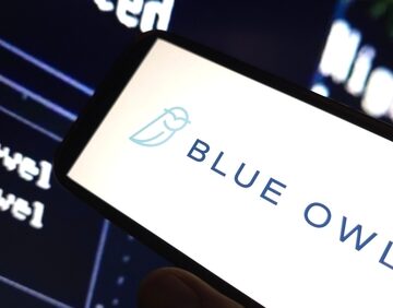 The logo for Blue Owl Capital, an alternative asset management firm focusing on credit, prominently displayed on a mobile device screen.