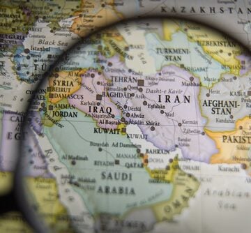 Magnifying,Glass,Over,A,Geographical,Map,Of,The,Middle,East HOW TO BRING PEACE TO THE MIDDLE EAST
