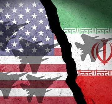 Flag,Of,Usa,And,Iran,Painted,On,A,Concrete,Wall BULLSHIT TRUMP SAYS DEAL WITH IRAN COULD BE CLOSE