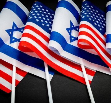 A series of small, handheld Israeli and United States flags arranged together, commonly used to represent the partnership and diplomatic ties between the two nations.