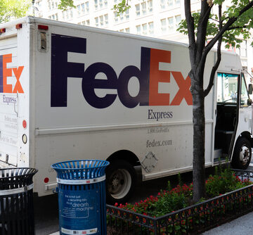 A FedEx Express delivery truck parked on a street in Washington, DC.