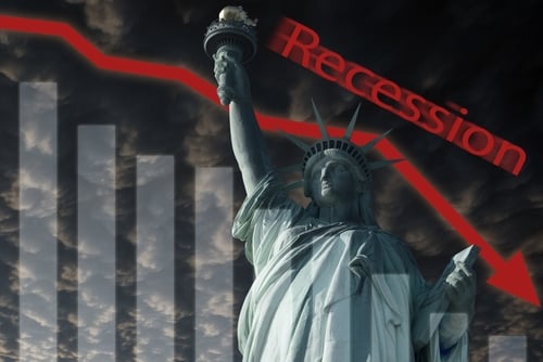 Concept image of an economic recession in the United States, featuring a graph with a downward-trending red arrow, the Statue of Liberty, the word "Recession" and a dark and cloudy background.