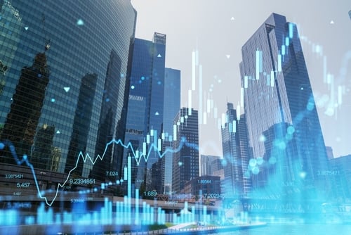 The image features a digital stock market candlestick chart overlaid on a blurry city skyline, symbolizing global business growth and financial investment.