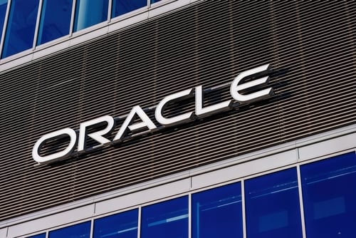 The logo for the multinational computer technology corporation Oracle on a building exterior.