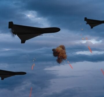 Military drones, likely Iranian-designed Shahed-136 "kamikaze" drones, flying in the night sky during an attack. Military drones, likely Iranian-designed Shahed-136 "kamikaze" drones, flying in the night sky during an attack.