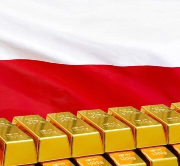 A stack of shiny gold bars with the Polish flag in the background.