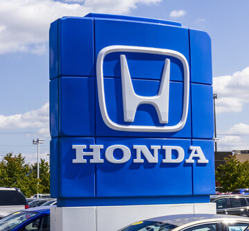 The blue and white monument sign typical of modern Honda dealerships.