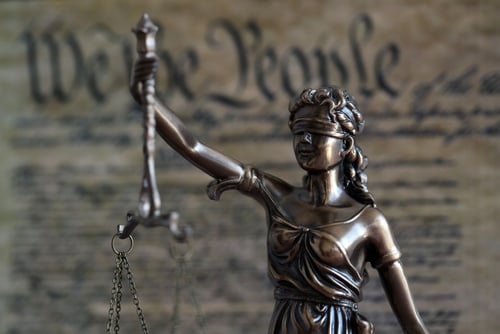 Dark,Scene,With,Lady,Justice,And,Background,Of,Us,Constitution DO WE STILL HAVE A CONSTITUTION?
