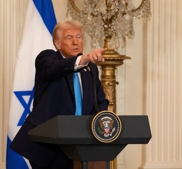 Washington,D.c.,,Usa,-,February,4,,2025:,U.s.,President,Donald Donald Trump standing in front of the U.S. and Israeli flags while speaking at a White House press conference.