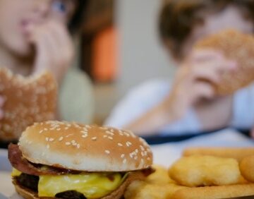 Children enjoying a greasy fast-food meal.