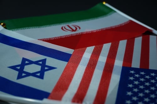 Miniature,Flags,Of,Israel,,Iran,,And,The,United,States,Are TOP IRANIAN ADVISER WARNS TRUMP NOT TO FALL INTO ISRAEL’S ‘STRATEGIC TRAP’