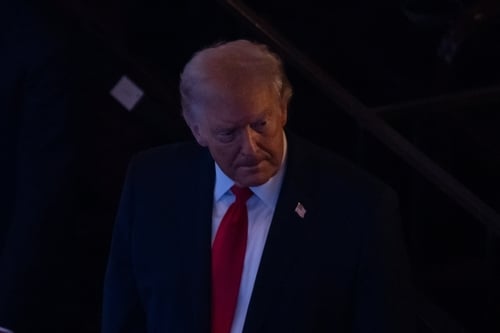 A dark photo of Donald Trump, the 45th and current 47th President of the United States.