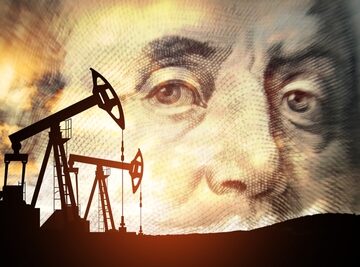 Oil,Price,Cap,Concept.,Petroleum,,Petrodollar,And,Crude,Oil,Concept. Petrodollar concept showing oil pump jack silhouettes with the enlarged face of Benjamin Franklin as the background.
