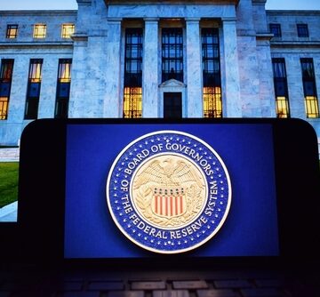 The U.S. Federal Reserve emblem on a podium in front of the Federal Reserve building in Washington, D.C.