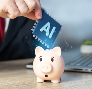 Image depicts "inserting" AI technology into a traditional savings vehicle (the piggy bank), symbolizing how AI is becoming a core part of modern financial strategies.