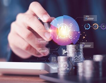 Digital AI concept of technology into financial management showing a person interacting with digital graphs, data overlays, and stacks of coins highlighting cash flow management and forecasting.