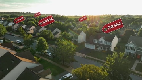 A residential neighborhood, likely a subdivision, with "FOR SALE" signs superimposed over several homes.