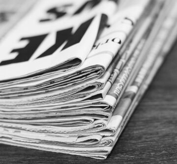 Newspapers,And,Documents.,Daily,Paper,With,News,On,Wooden,Table. DEATH OF JOURNALISM: JAMES MURDOCH BUYS HALF OF VOX MEDIA