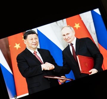 Warsaw,,Poland,-,Feb,5,,2026:,Chinese,President,Xi,Jinping Chinese President Xi Jinping and Russian President Vladimir Putin shaking hands during a state visit, highlighting their strategic alliance.