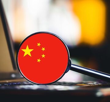 Laptop,Keyboard,With,Magnifying,Glass.,Chinese,Flag,Symbol.,Digital,Surveillance AI IS WATCHING YOU: CHINA REVAMPS ITS SURVEILLANCE NETWORK WITH NEW AI TECH