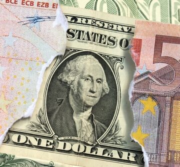 Conceptual representation of currency exchange features a torn U.S. one-dollar bill overlaid on top of a 50 Euro banknote. Conceptual representation of currency exchange features a torn U.S. one-dollar bill overlaid on top of a 50 Euro banknote.