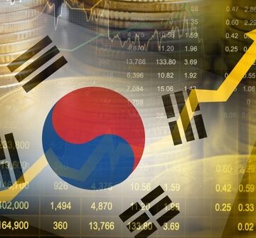 The South Korean flag with stock market data and an upward economy trend graph. The South Korean flag with stock market data and an upward economy trend graph.