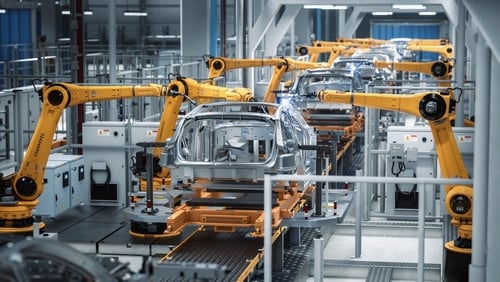 An automated industrial production line for manufacturing vehicles which features multiple robotic arms engaged in welding or assembly processes on vehicle frames. An automated industrial production line for manufacturing vehicles which features multiple robotic arms engaged in welding or assembly processes on vehicle frames.