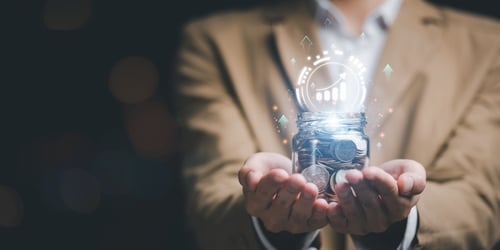 A man holding a jar of coins with a digital overlay of a growth graph icon rising from the jar.