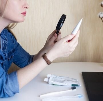 Toothpaste,Ingredients.,Girl,At,Laptop,Checks,Composition,Of,Toothpaste,And 90% OF POPULAR TOOTHPASTE BRANDS TESTED POSITIVE FOR LEAD