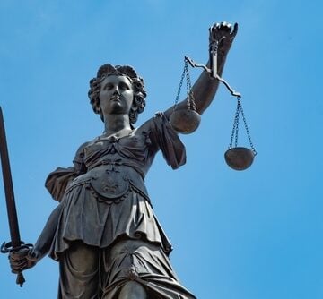 Frankfurt,germany,-,August,10,2023:,Statue,Of,Lady,Justice,In,Frankfurt The Fountain of Justice located in Römerberg Square, Frankfurt, Germany. The statue represents Lady Justice (Justitia), holding scales in one hand and a sword in the other.