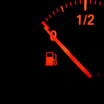 Red,Fuel,Gauge,Warning,Light,Showing,Low,Fuel,Level,On A red fuel gauge indicator showing the fuel tank is empty.