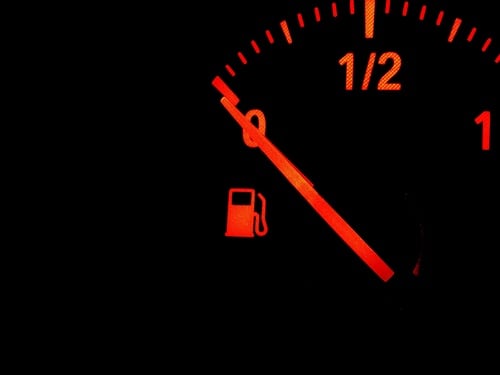 Red,Fuel,Gauge,Warning,Light,Showing,Low,Fuel,Level,On A red fuel gauge indicator showing the fuel tank is empty.