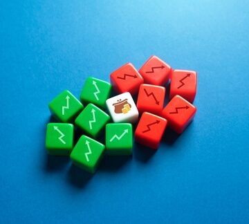 Profit,And,Loss,In,The,Home,Budget.,Control,Expenses,,Cost Green dice with upward arrows, and red dice with downward arrows surrounding a center die with a money bag image.
