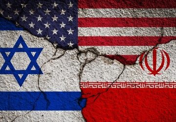Image of the flags of Israel and Iran, side-by-side, against a cracked concrete wall.