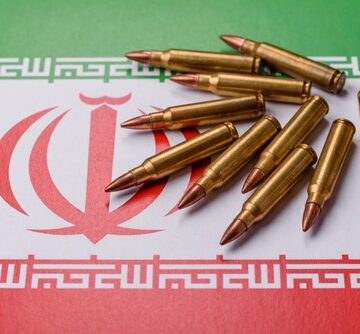 Brass-cased rifle cartridges, arranged on the national flag of Iran. Brass-cased rifle cartridges, arranged on the national flag of Iran.