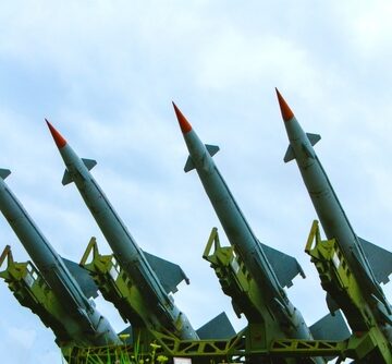 Four,S-125,Anti-aircraft,Missiles,Lined,Up,In,The,Sky.,The A Soviet-designed S-125 Neva/Pechora surface-to-air missile system.
