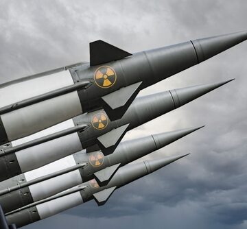 Missiles,With,Warheads,Are,Ready,To,Be,Launched.,Missile,Defense. Nuclear-armed missiles aimed at a cloudy sky.