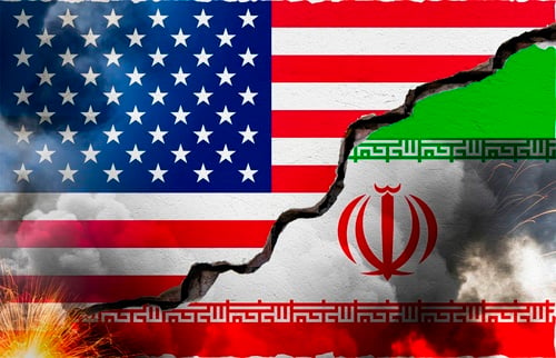 The flags of the U.S. and Iran separated by a large crack. The flags of the U.S. and Iran separated by a large crack.
