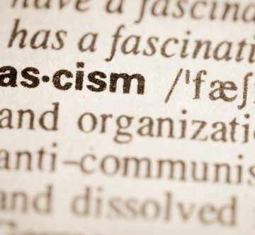 Definition,Of,Word,Fascism,In,Dictionary A close-up dictionary entry for the word "fascism" highlighting its phonetic pronunciation and a portion of its definition.