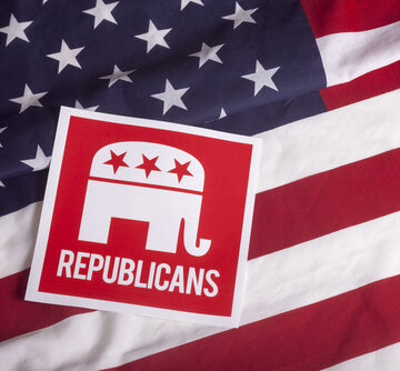 Republican,Election,On,Textured,American,Flag The official logo of the Republican Party, featuring the GOP elephant, positioned on a background of the American flag.