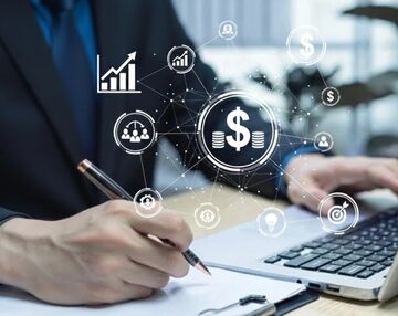 Businessman,Analyzing,Financial,Data,With,Digital,Dollar,Interface.,Fintech,,Investment GAP BETWEEN PAY AND PROFITS GROWS WIDER