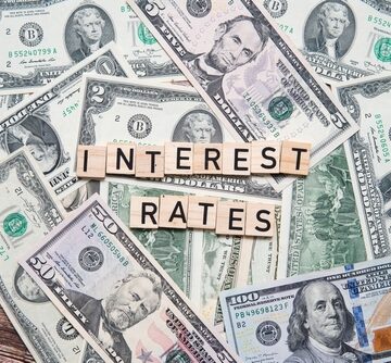 The,Inscription,Interest,Rates,On,The,Background,Of,American,Dollars. WAR ADDS BILLIONS IN INTEREST TO U.S. GOVERNMENT DEBT