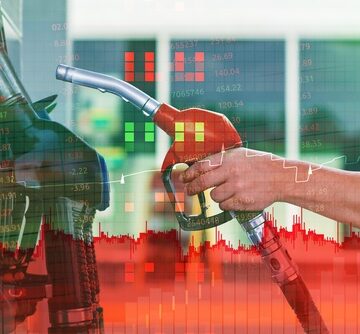 Person,Holding,A,Fuel,Nozzle,At,A,Gas,Station,With WAR COSTS AMERICAN HOUSEHOLDS $450 A MONTH IN ENERGY EXPENSES