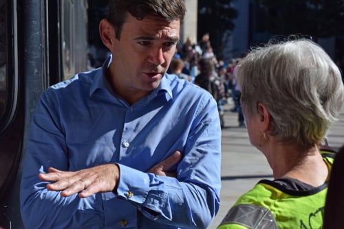 Labour Party MP Andy Burnham, who has served as the Mayor of Greater Manchester since 2017, speaking with a constituent. Labour Party MP Andy Burnham, who has served as the Mayor of Greater Manchester since 2017, speaking with a constituent.